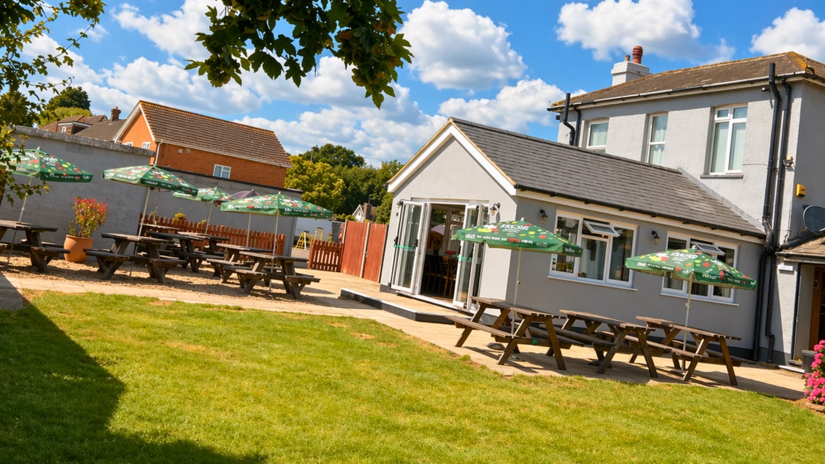 The Anchor beer garden with seating directly under the Heathrow flight path