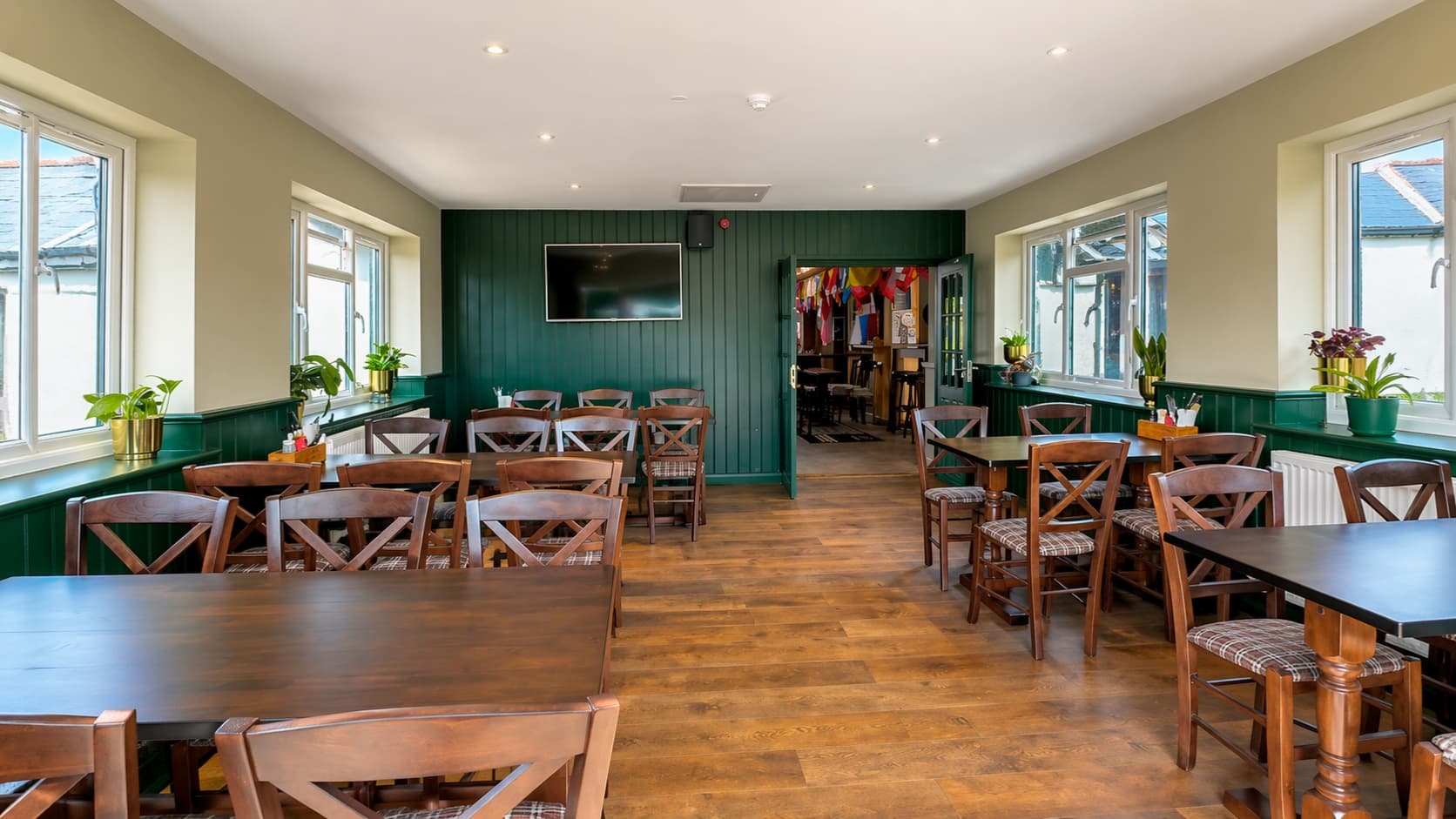 The Anchor dining room interior with warm lighting and table settings